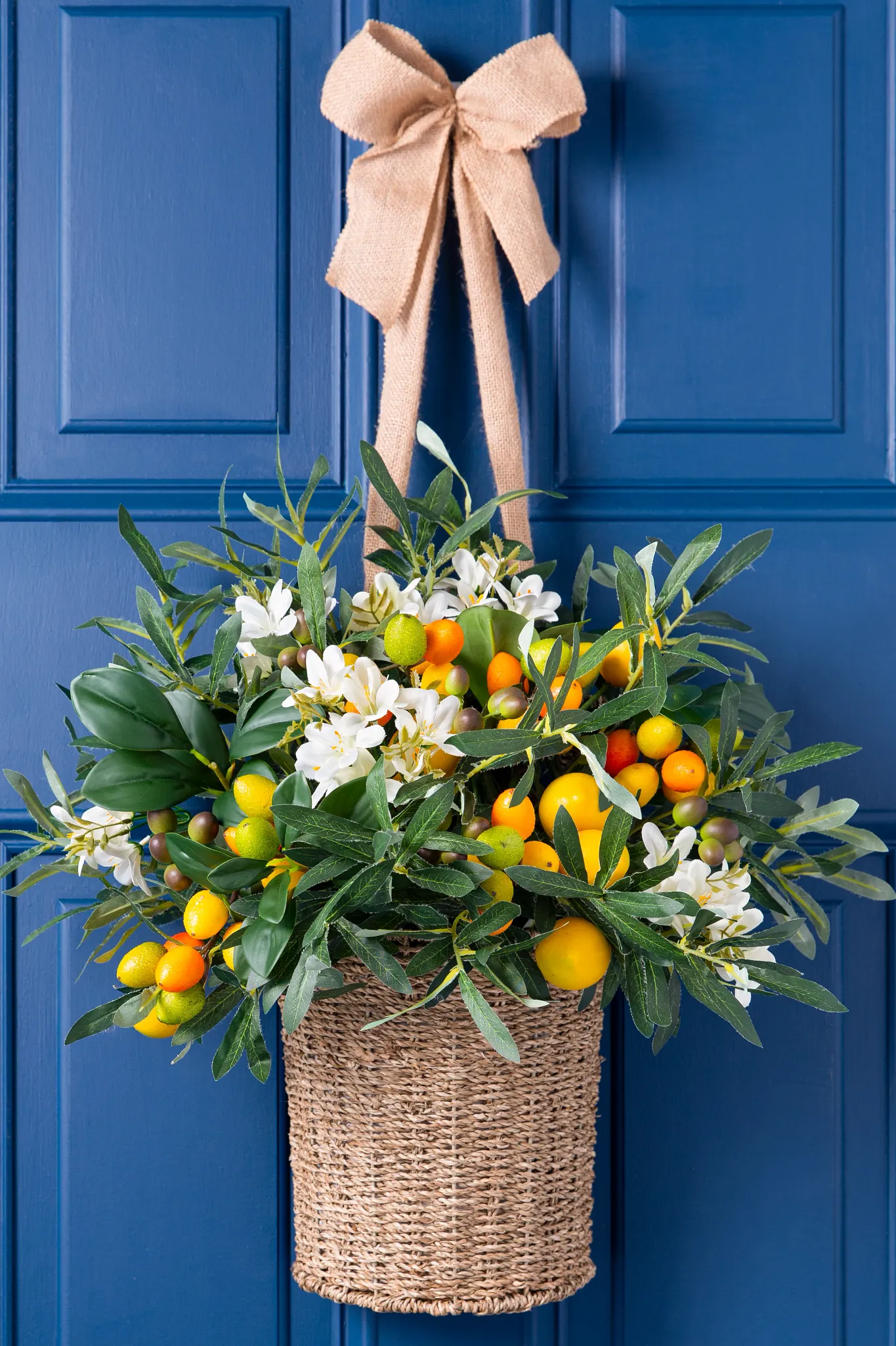 Artificial hanging basket with faux lemons and kumquats