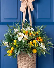Artificial hanging basket with faux lemons and kumquats
