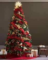 Christmas tree with velvet ribbon and red and green decorations
