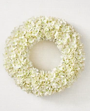 Ivory hydrangea wreath against a white background