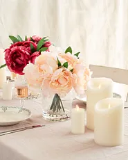 Dining room table candle centerpiece with flower arrangements