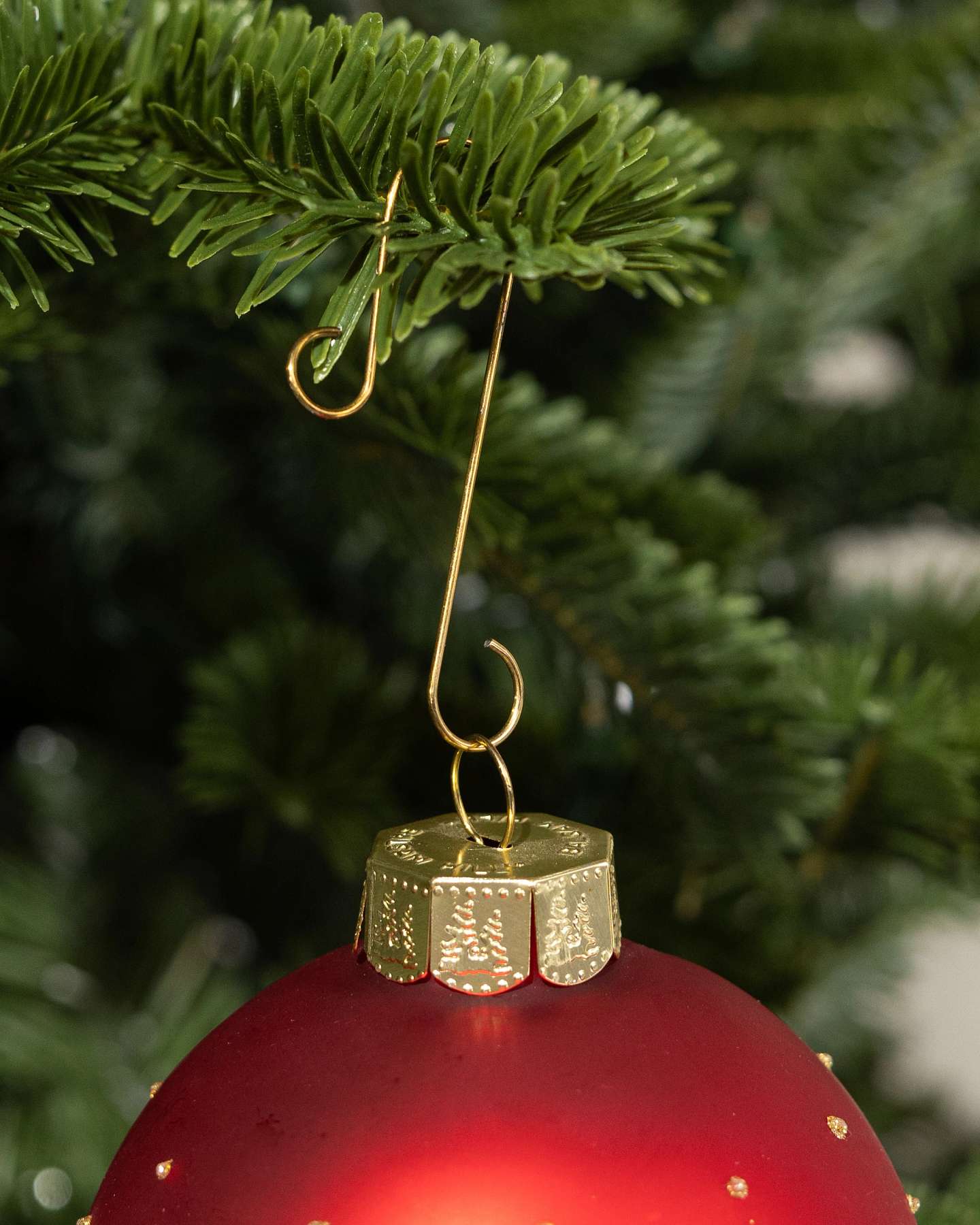 Balsam Hill Gold Large Christmas Ornament Hooks Set of 100 Holding a Christmas Ornament