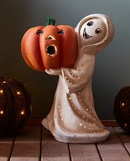 Ghost figure statue with Jack-o’Lantern