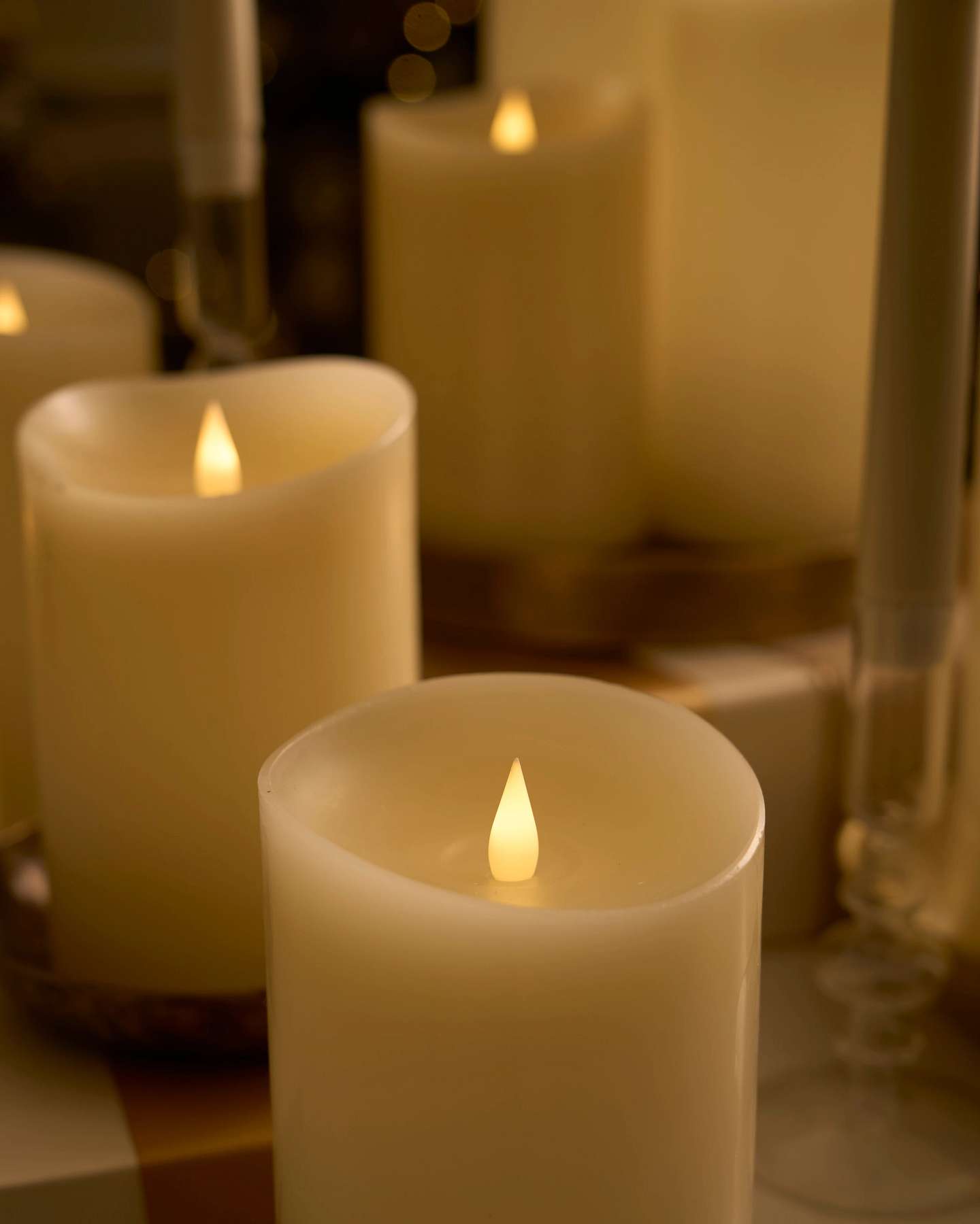 Balsam Hill Miracle Flame Premium 3D LED Wax Pillar Candles Displayed in Cozy Living Room