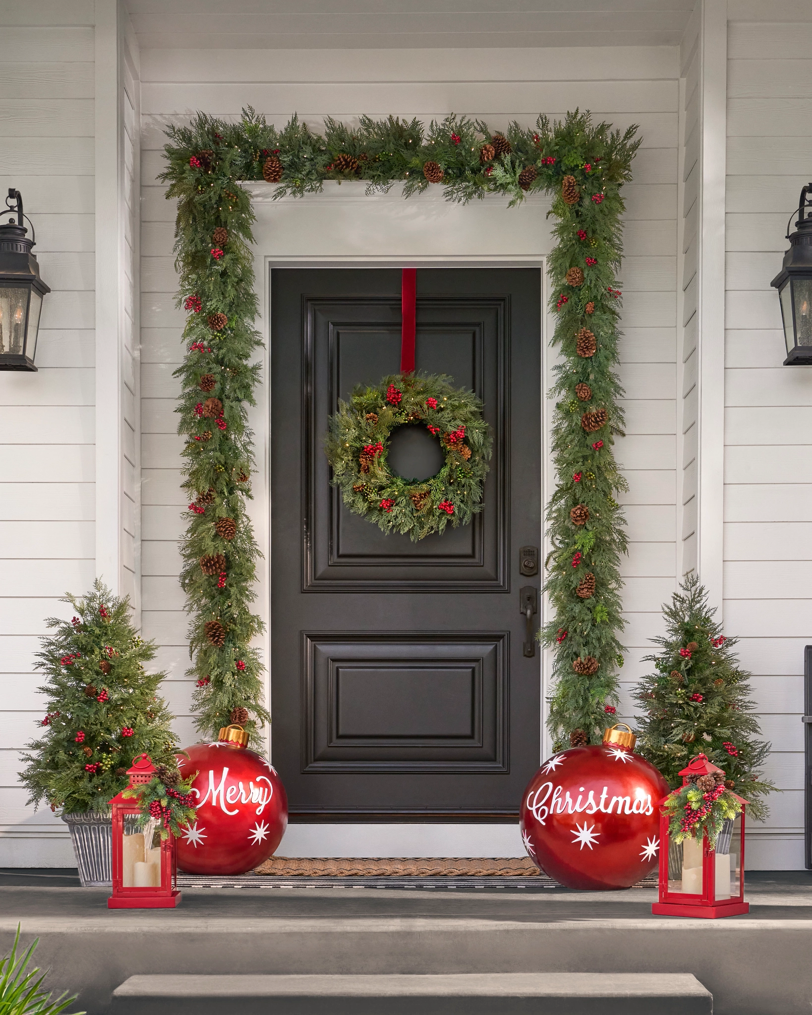 Christmas wreath and garland on a festive front door.