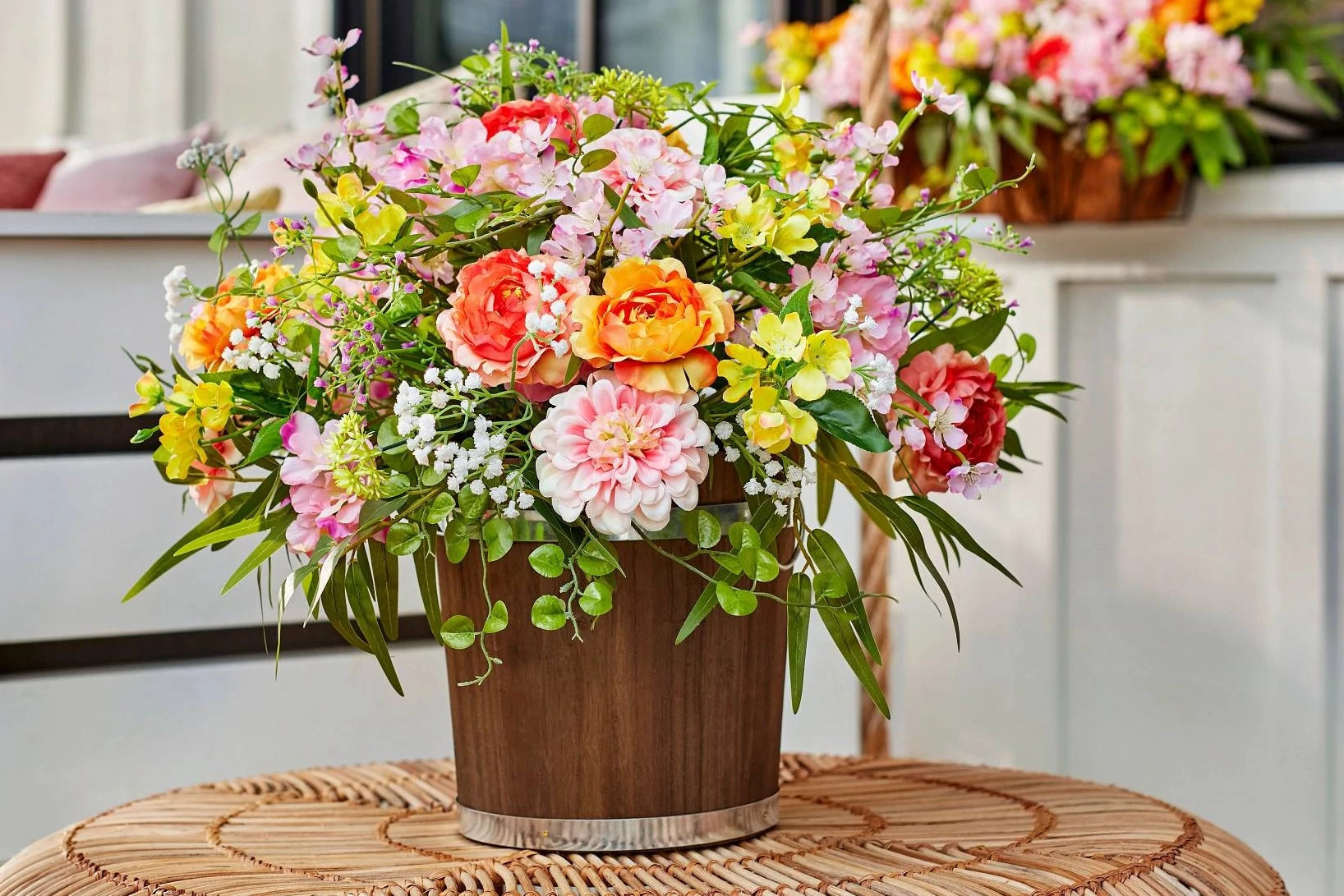 Flower arrangement in a wooden bucket