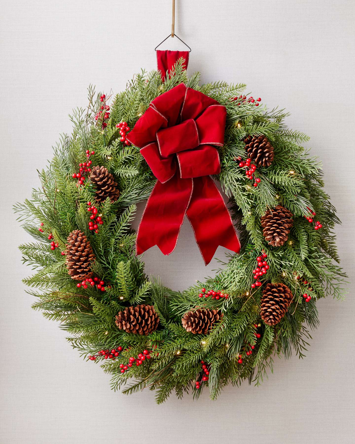 Balsam Hill 32-Inch Double-Sided Red Berry Pinecone Wreath Lit Closeup