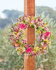 Wildflower wreath on wooden column