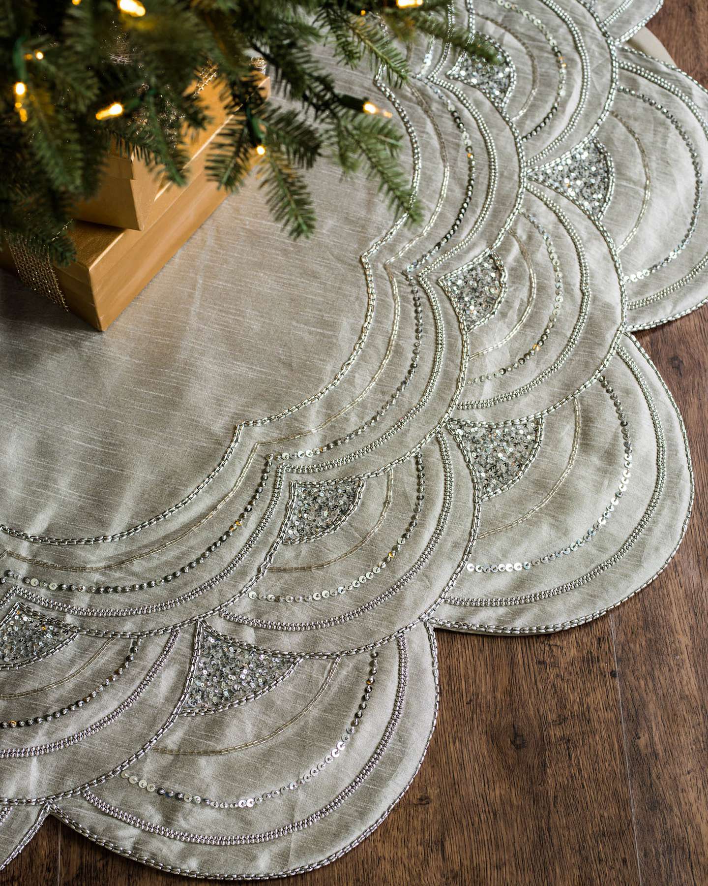 Balsam Hill Silver Elizabeth Beaded Artificial Christmas Tree Skirt Showcased under a Tree