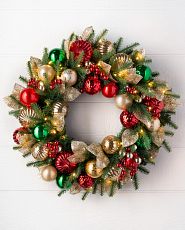 Christmas wreath decorated with red, green, and gold ornaments