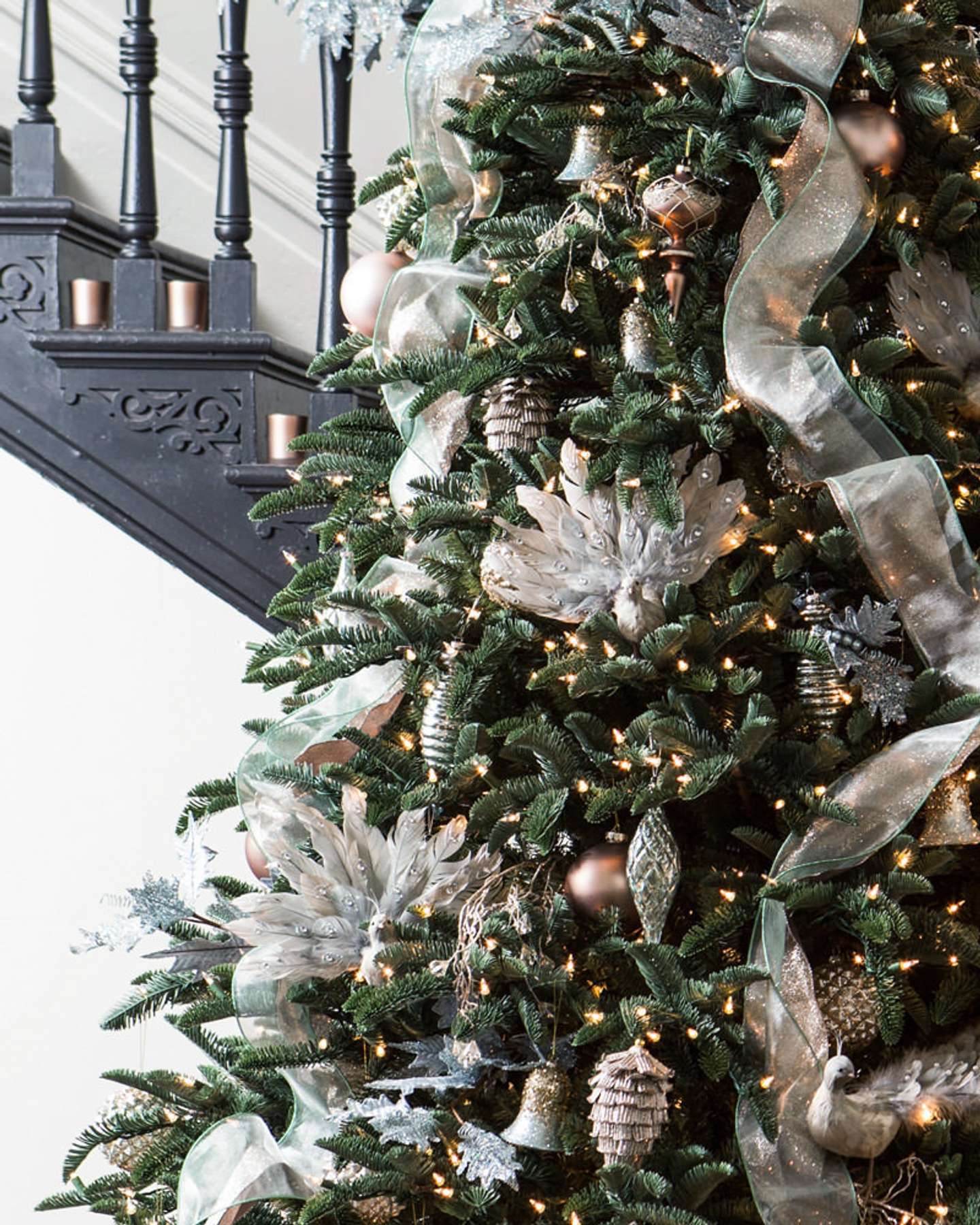 Balsam Hill Noble Fir Narrow Artificial Christmas Tree Lifestyle Display Near Stairs