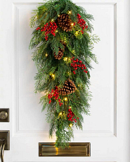 Artificial evergreen swag with red berries and pinecones