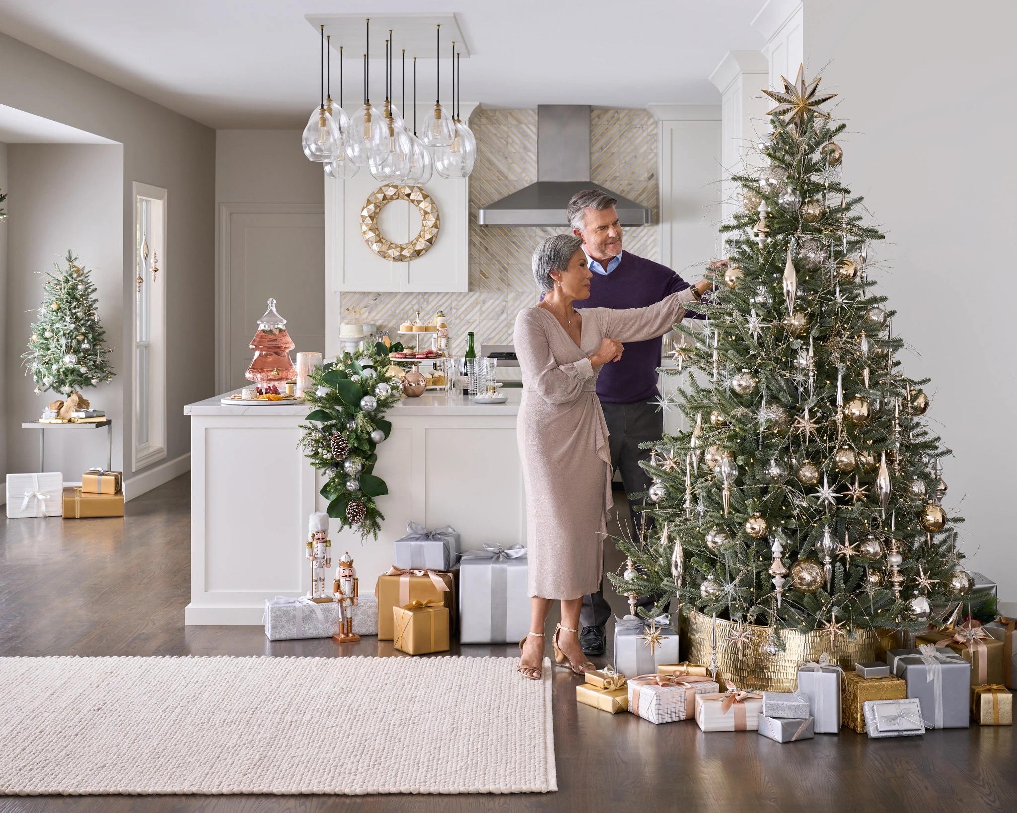 Older couple decorating a Christmas tree