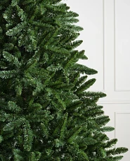 Close-up of artificial Christmas tree with traditional PVC needles