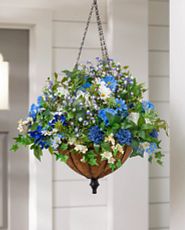 Hanging basket with blue artificial flowers