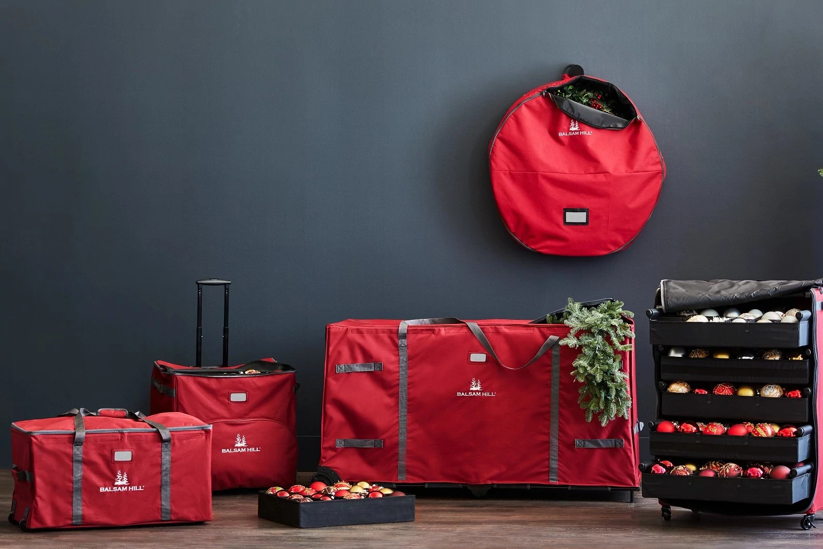 Group of red Balsam Hill storage bags for greenery, ornaments, and other Christmas decorations