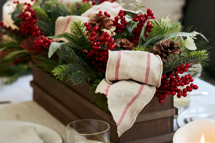Closeup of a boxed arrangement of Christmas greenery