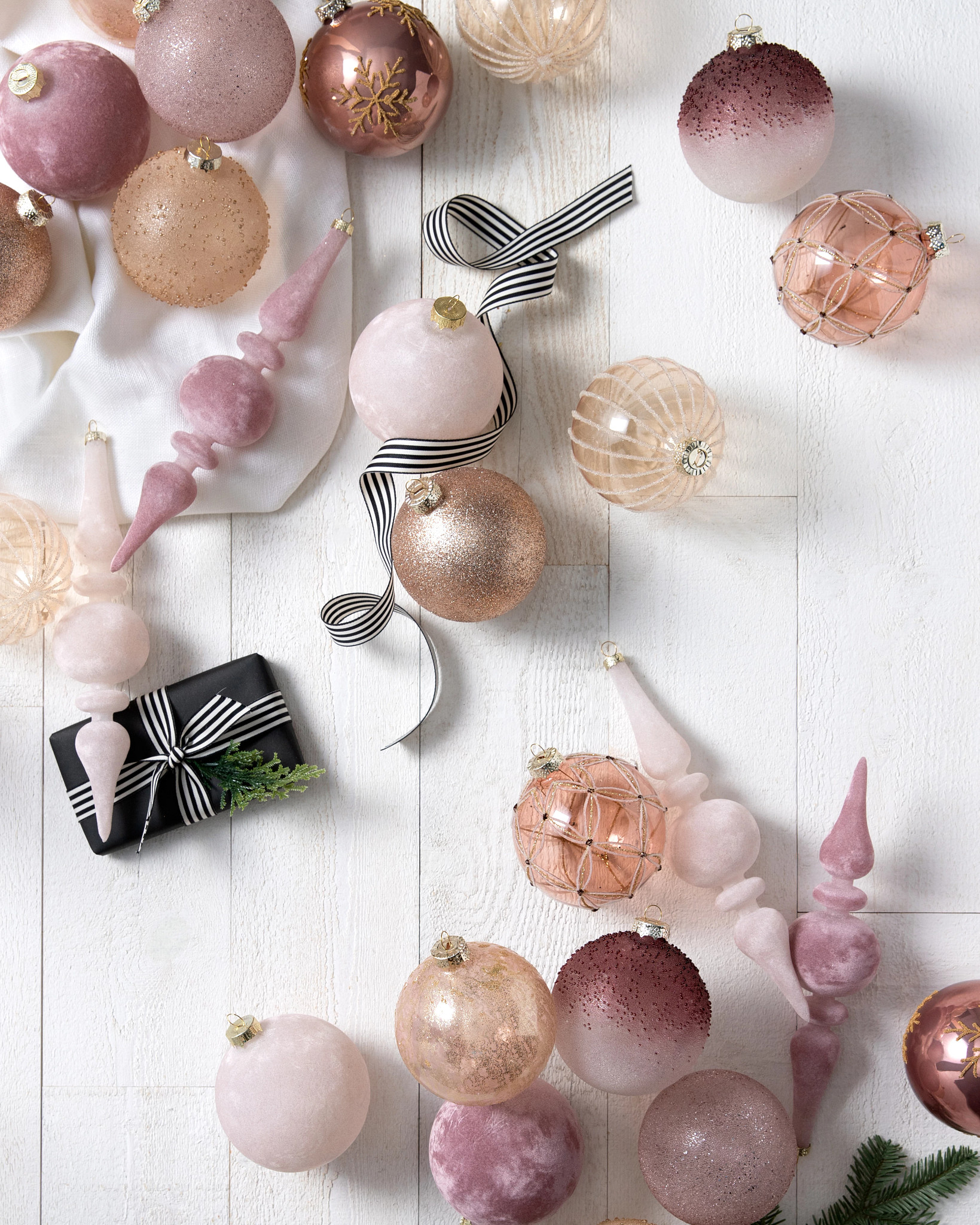 Assorted blush, gold, and ivory Christmas ornaments