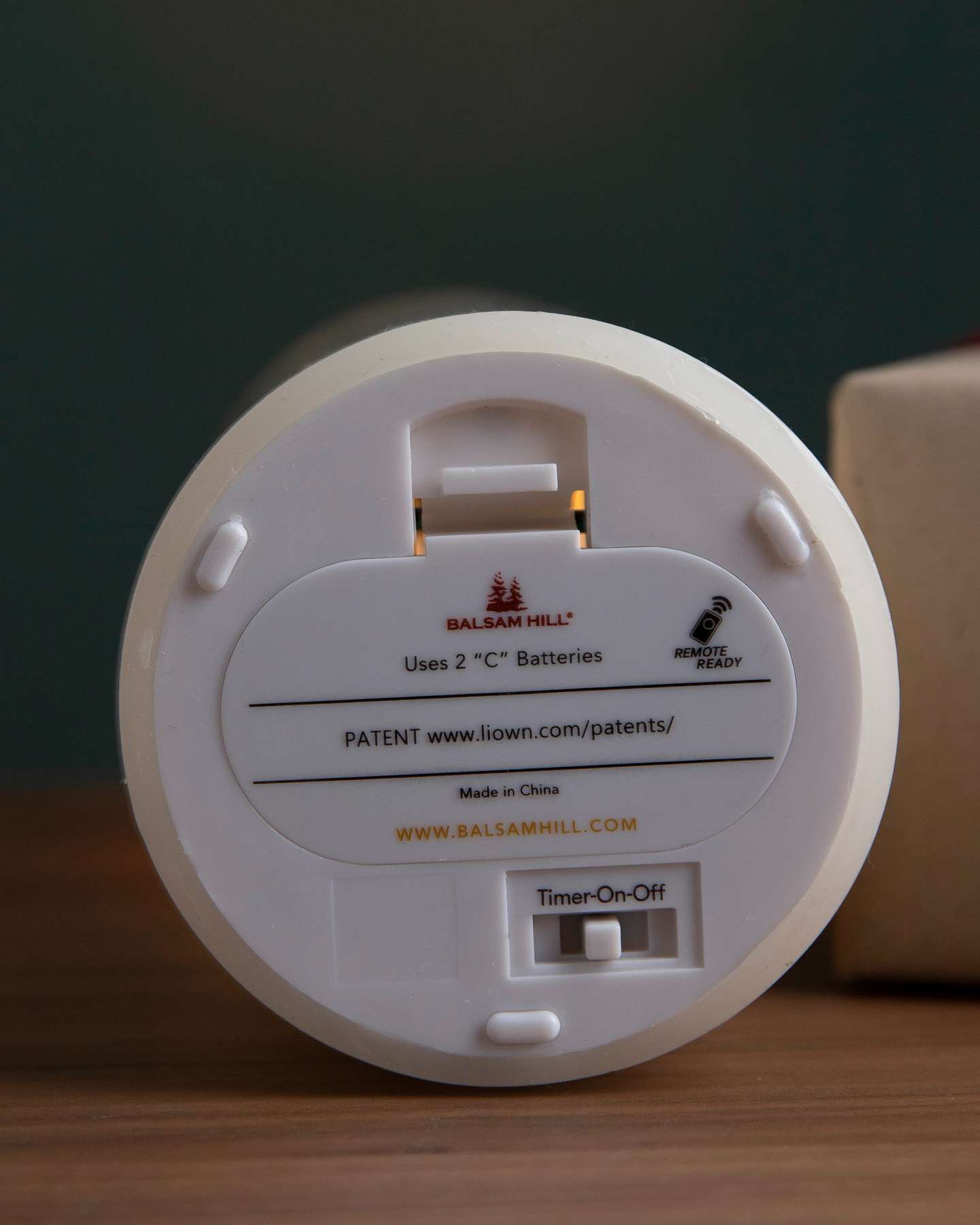 Balsam Hill Miracle Flame LED Wax Pillar Candle Battery Compartment Close-Up with On/Off Feature
