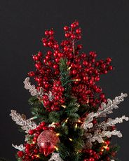 Christmas tree topper with red berries