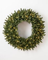 Artificial Christmas wreath pre-lit with warm LED lights