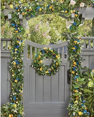 Summer flower foliage on gray wooden fence
