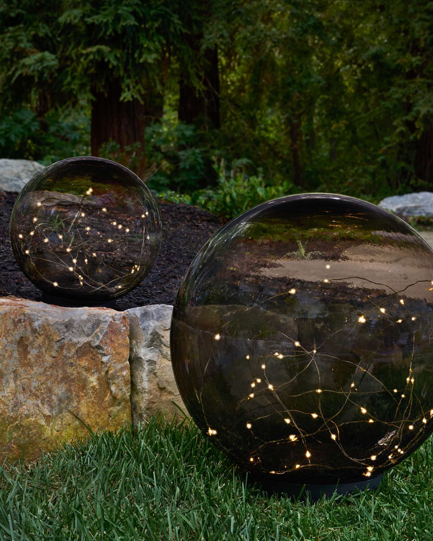 Balsam Hill Tinted Outdoor Solar Globe Stake Lights Set of 2 in a Garden Setting