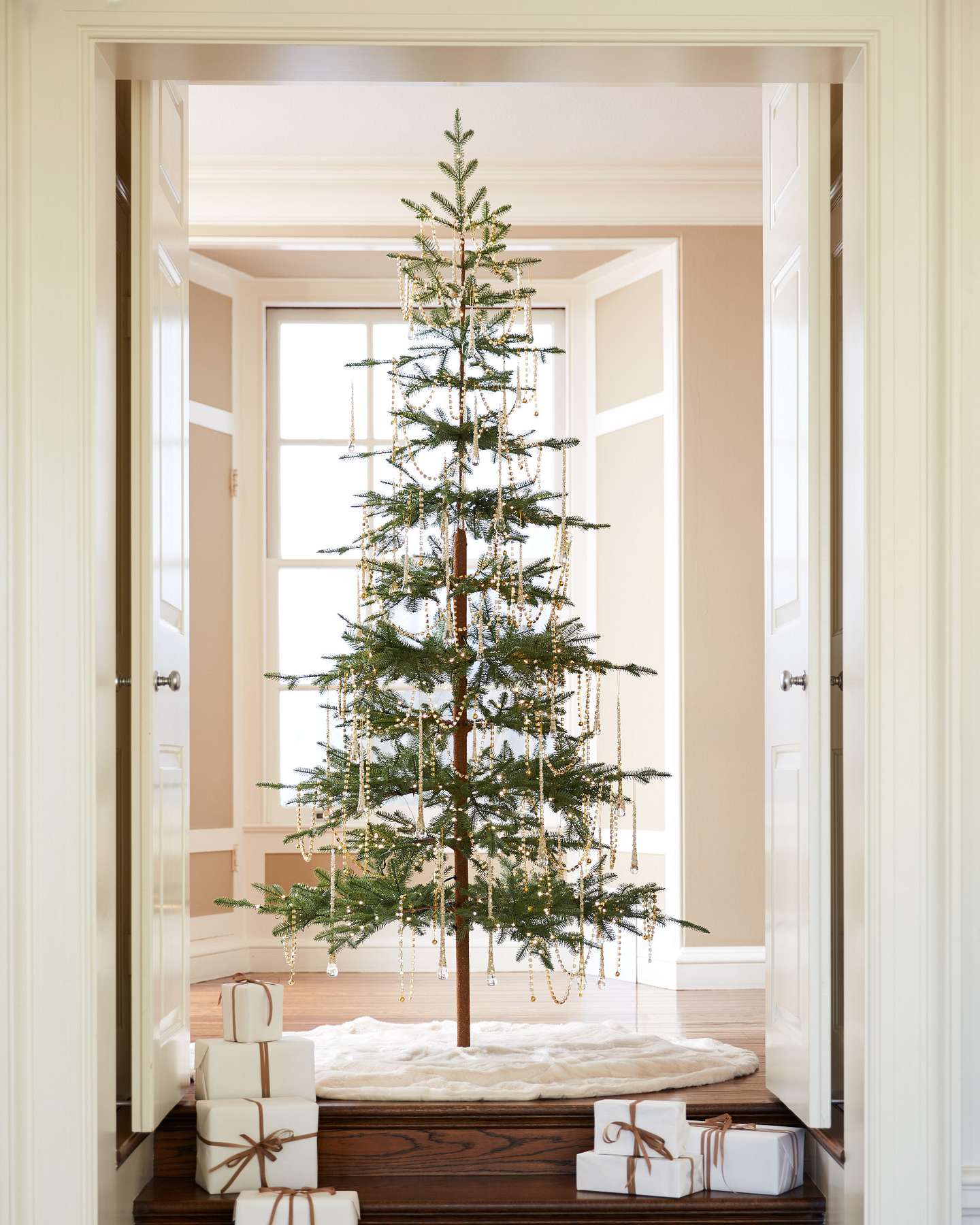 Balsam Hill Icy Teardrop Ornaments Lifestyle Display on Artificial Christmas Tree with Open Doors