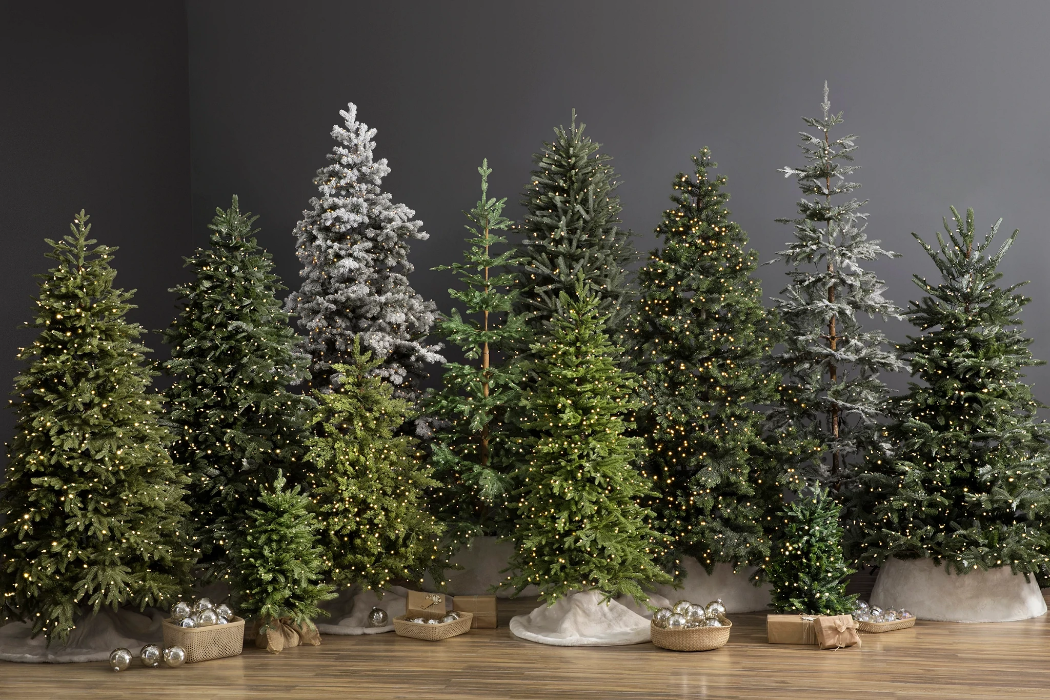 Different artificial Christmas tree sizes, colors, and lights