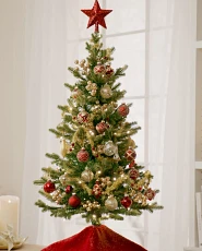 Mini tabletop tree decorated with red and gold ornaments