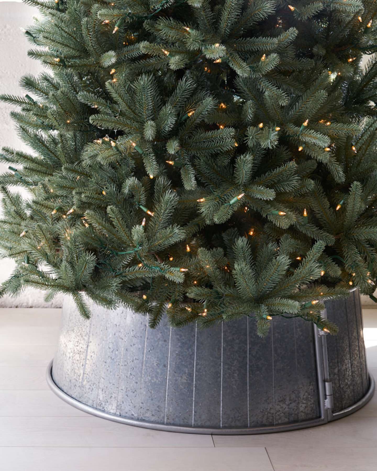 Balsam Hill Blue Spruce Flip Artificial Christmas Tree Closeup with Tree Collar