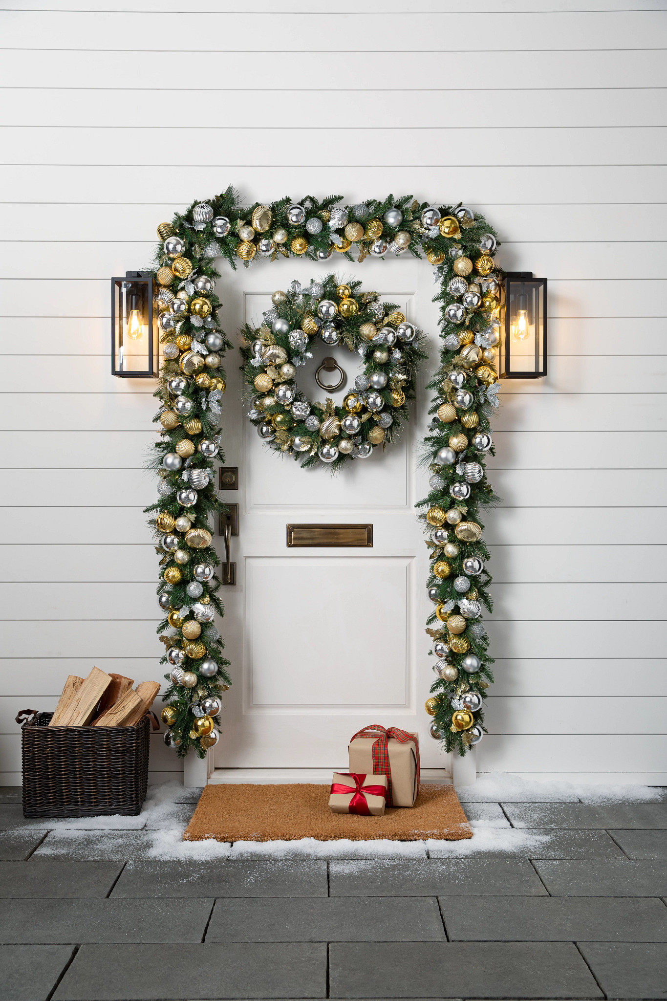 White front door with artificial wreath and garland