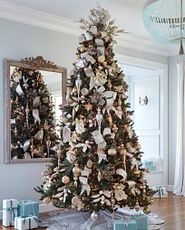 Artificial Christmas tree with silver and gold ornaments