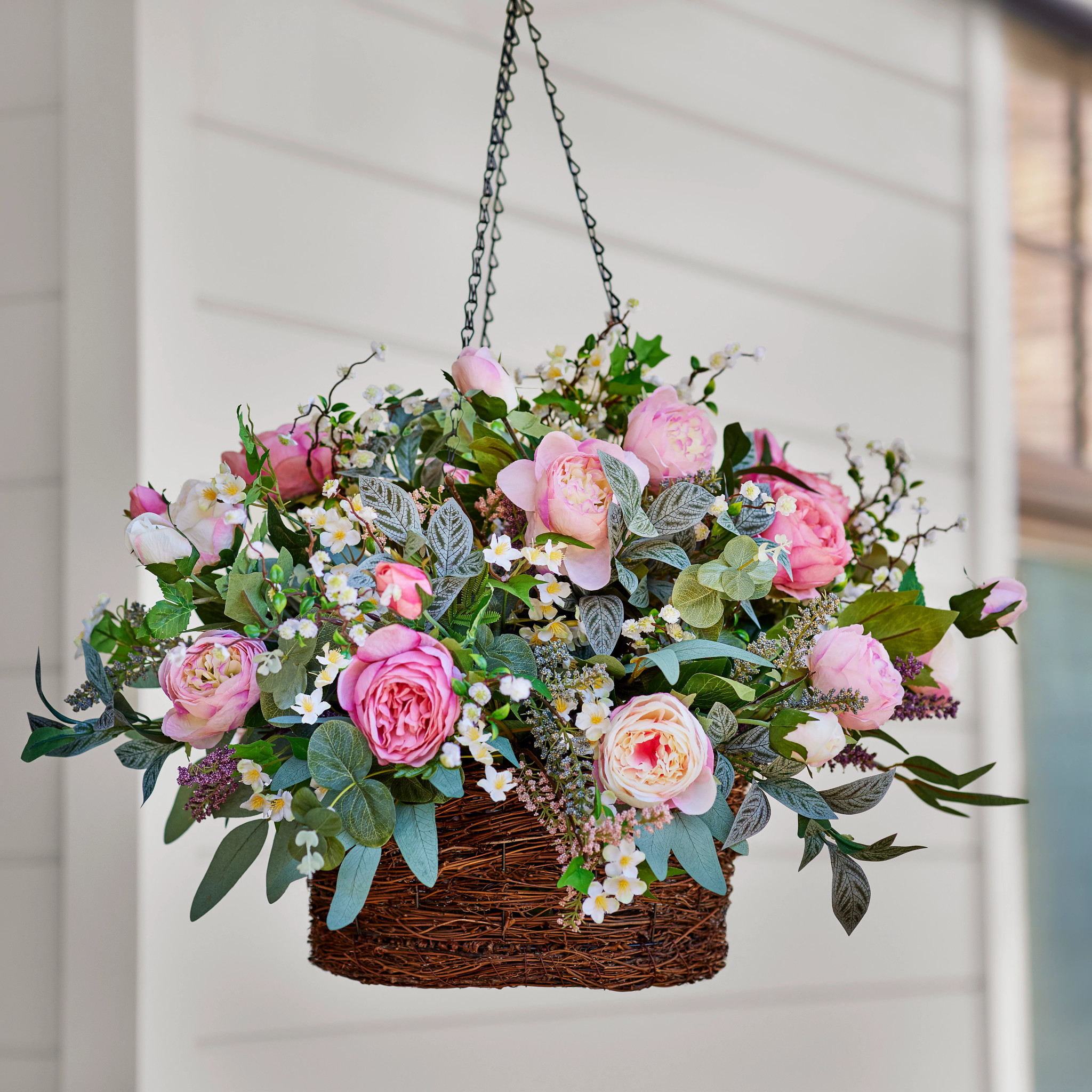 outdoor hanging basket with pink flowers