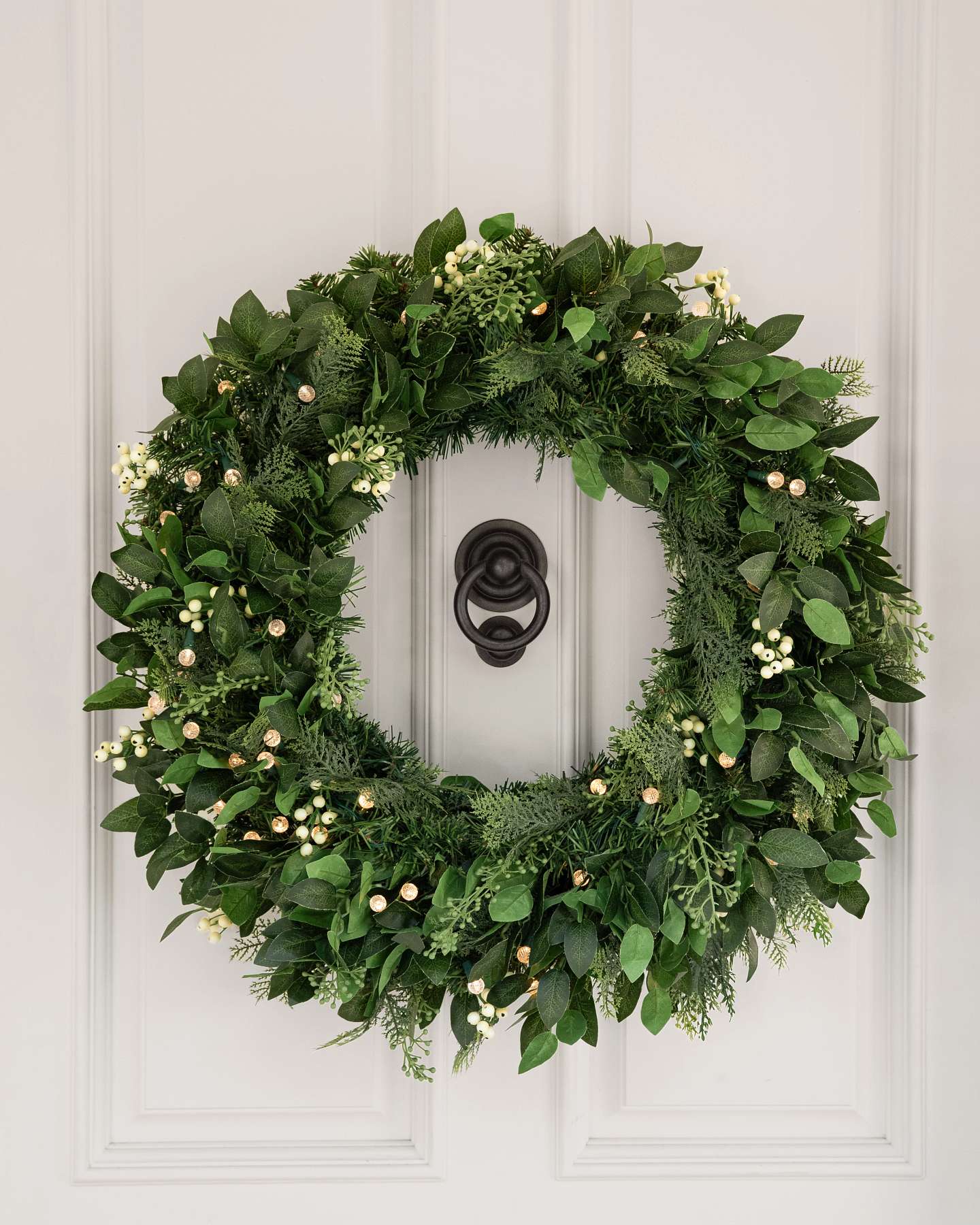 Balsam Hill White Berry Cypress Artificial Christmas Foliage on Table Lifestyle