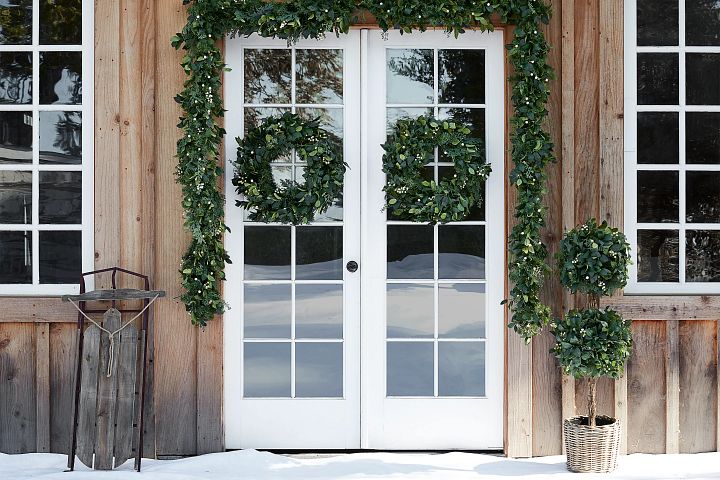 Christmas wreaths and garlands on a front door