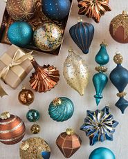 Assorted Christmas ornaments in navy, copper, and turquoise