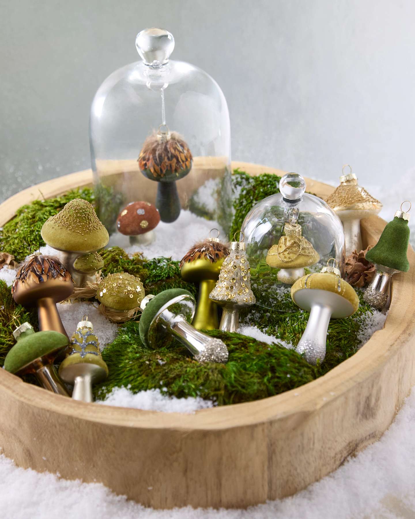 Balsam Hill Green Woodland Glass Mushroom Christmas Ornaments Set of 15 Showcased on A wooden base with Green Moss