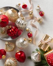 Assorted red, gold, and silver mercury glass Christmas ornaments