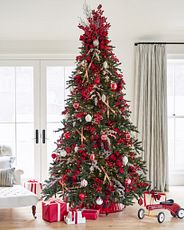 Artificial Christmas tree decorated with red and white ornaments