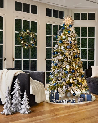 Christmas tree with blue, silver, and gold ornaments