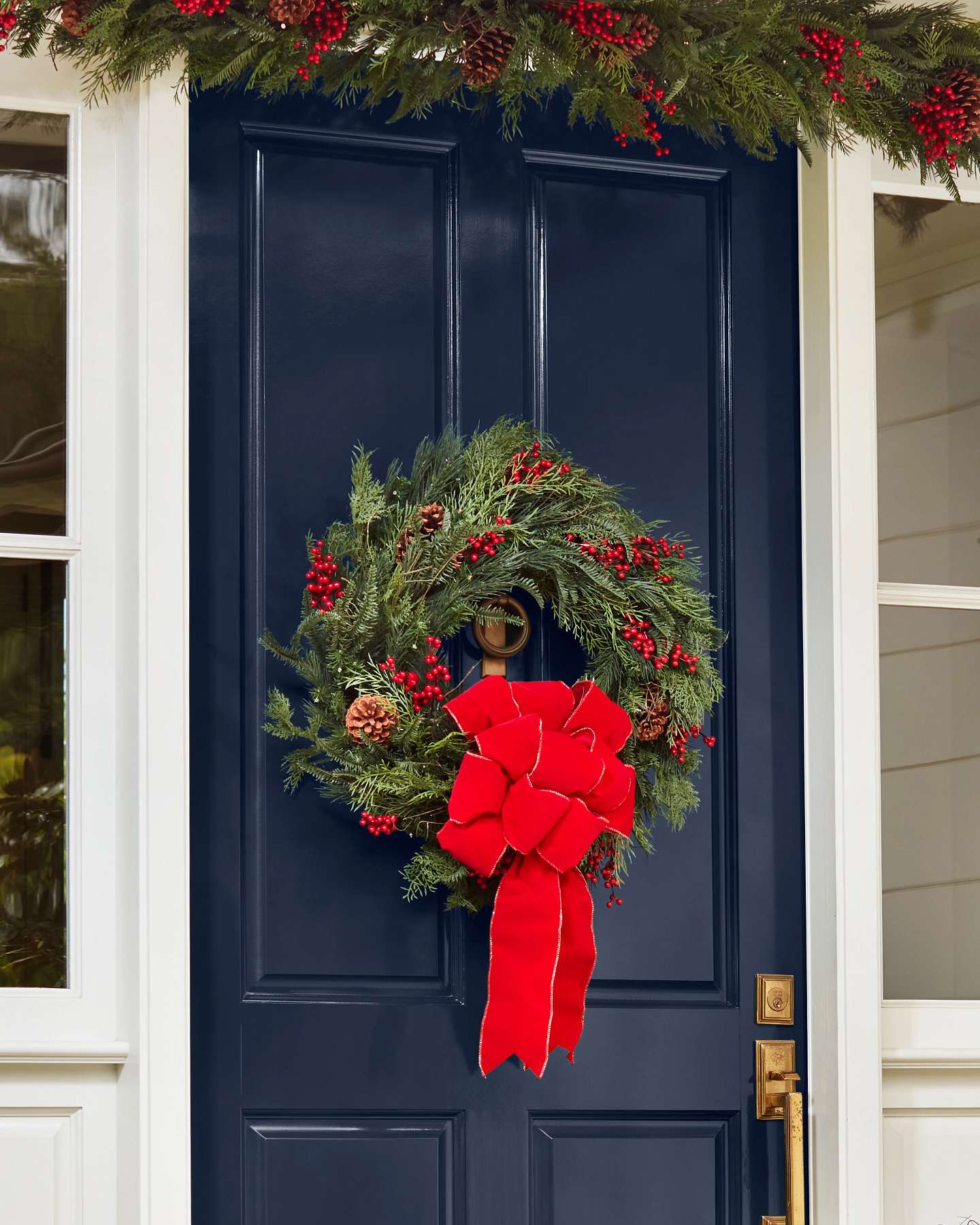 Balsam Hill Outdoor Red Berry Pine Artificial Christmas Foliage in a Festive Home