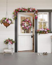 Front door décor with wreaths, garlands, and other greenery