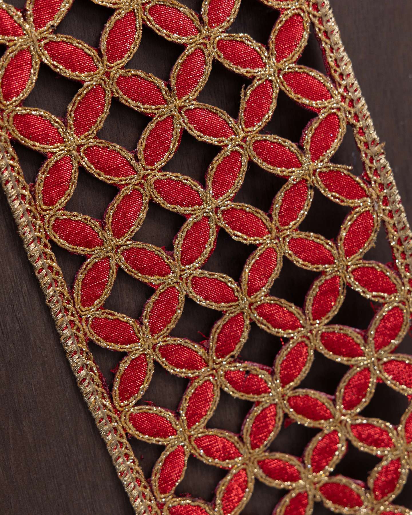 Balsam Hill 10-Yard x 4-Inch Red and Gold Lattice Cutout Artificial Christmas Tree Ribbon Closeup View