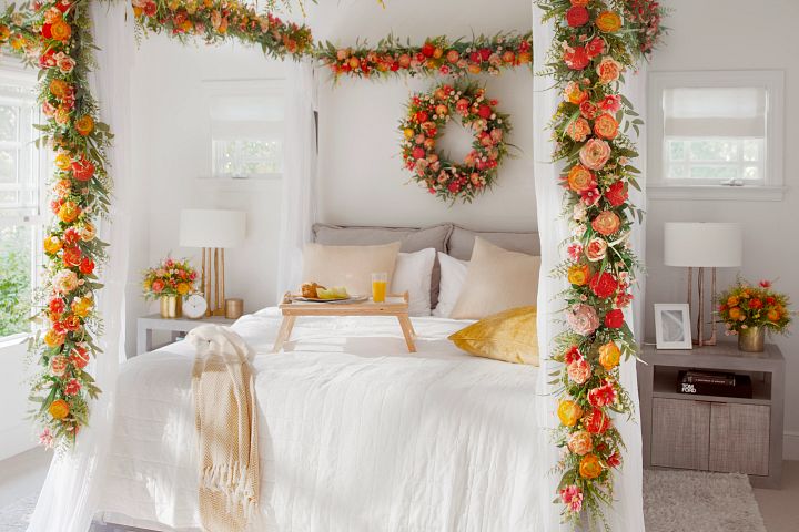 Bedroom with flower garlands and wreath