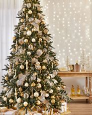 Artificial tree decorated with silver and gold ornaments