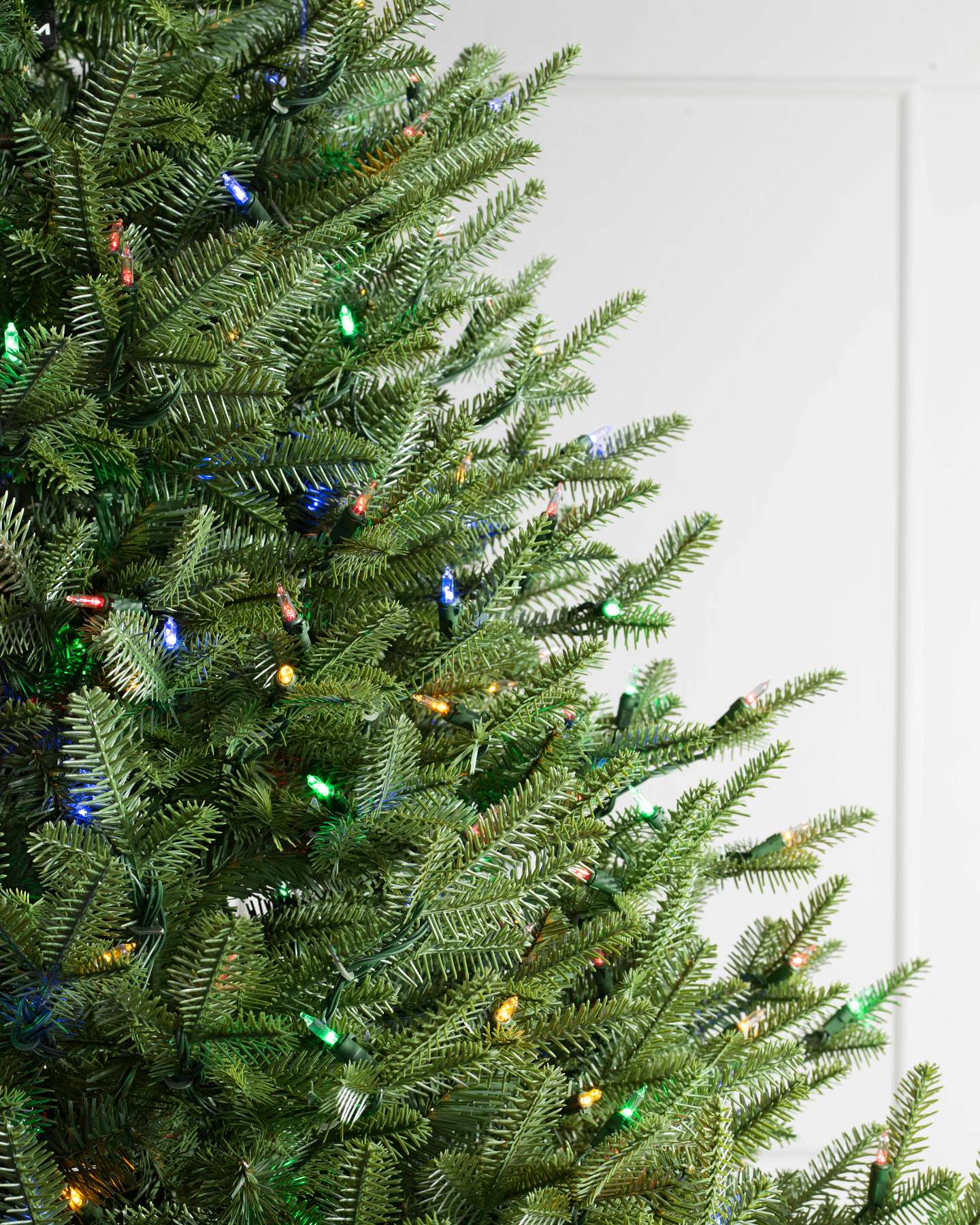 Balsam Hill Balsam Fir Wide Artificial Christmas Tree Closeup with LED Color Changing Lights Closeup