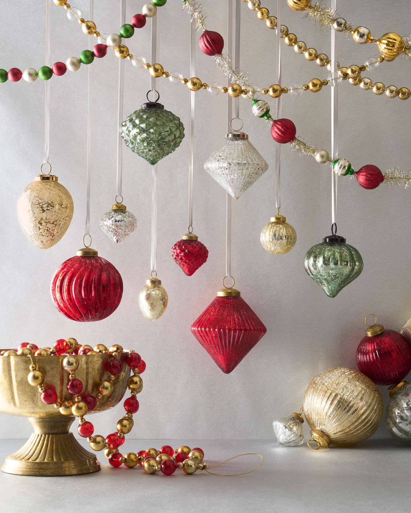 Balsam Hill Essentials Mercury Glass Christmas Ornament Set Lifestyle Display with Tree Garlands