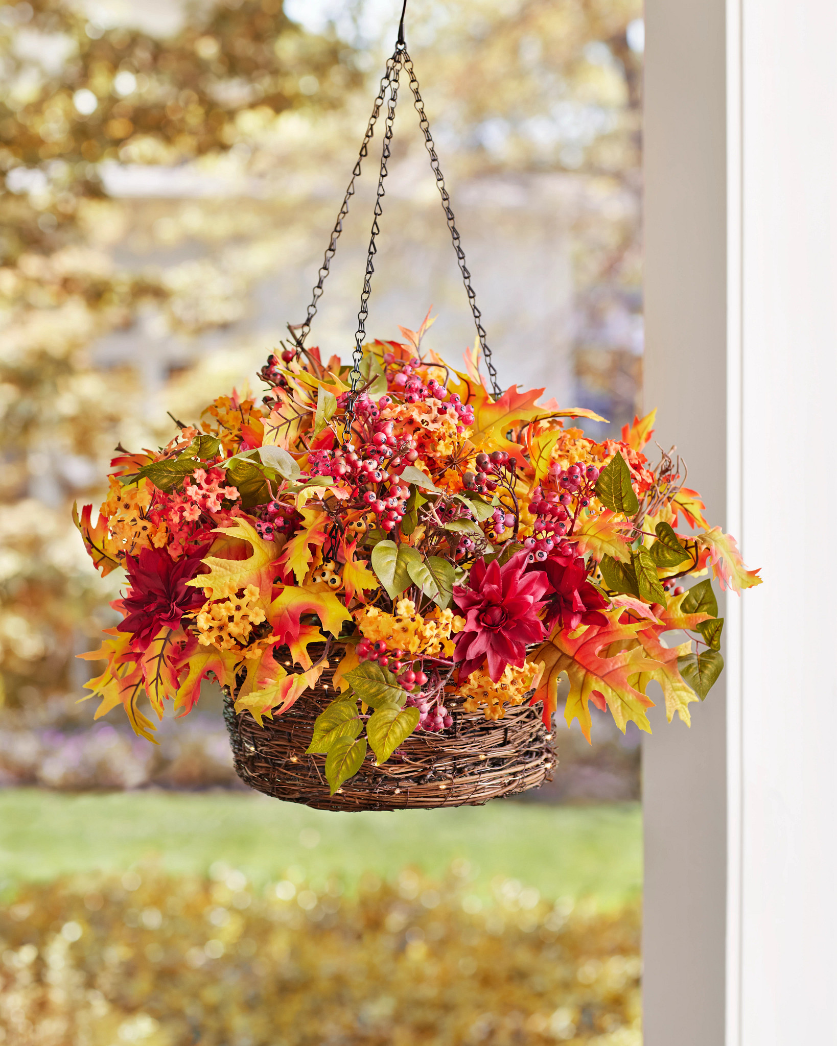 Hanging basket with artificial fall leaves