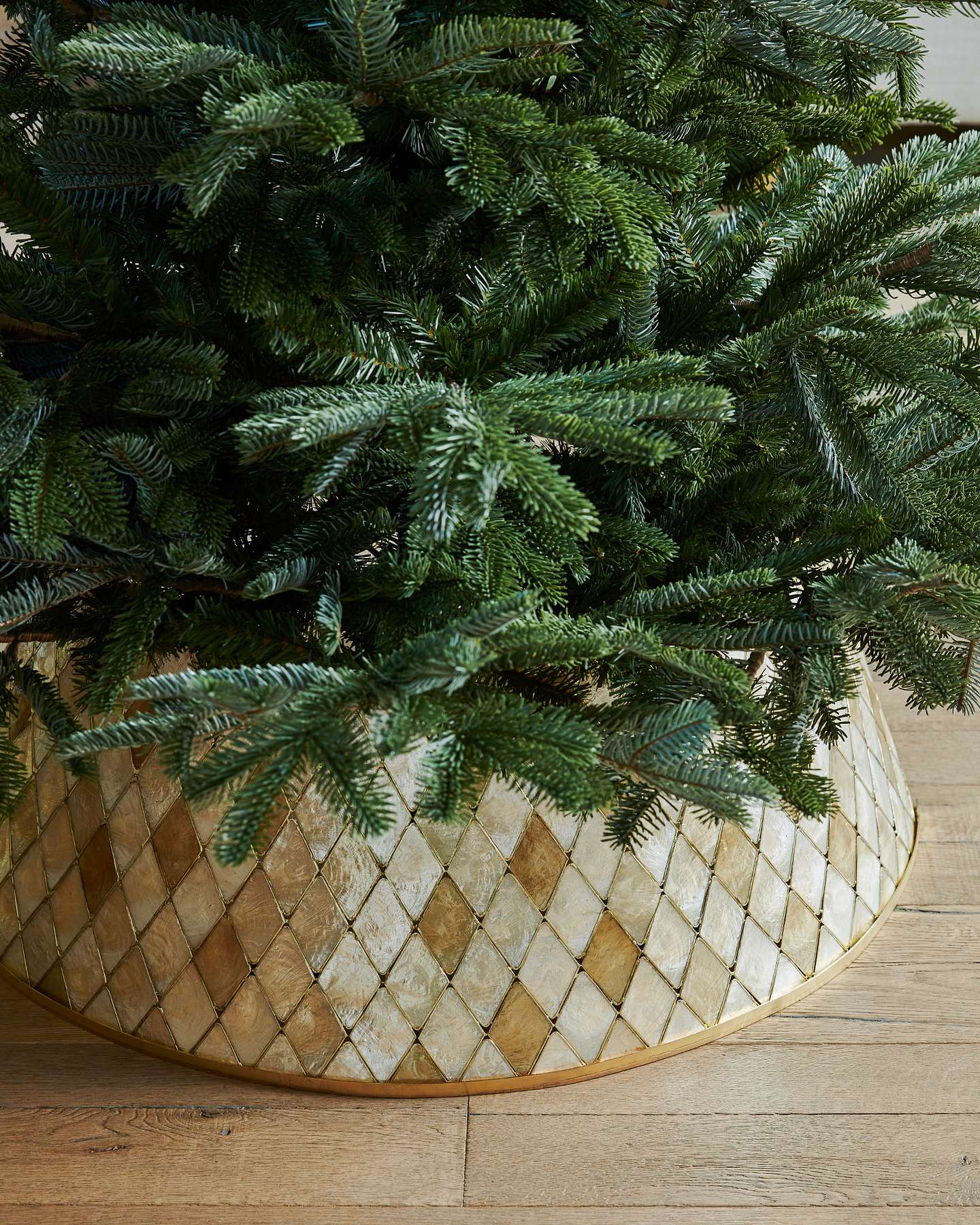 Balsam Hill Capiz Artificial Christmas Tree Collar Displayed with Ornaments